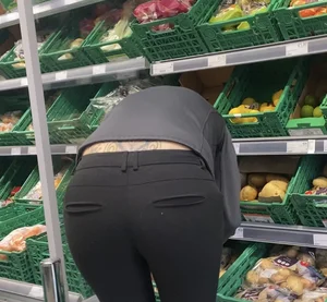 Milf bending over wearing pink thong VPL