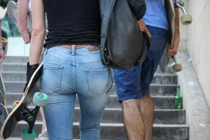 Hot brunette skateboarder in tight jeans and with hard nipples