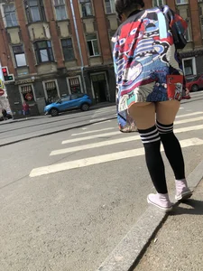An Anime Fan Teen in a Short Skirt And Stockings Bending Over on the Crosswalk Street Creepshots