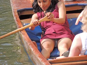 Girl Flashing Panties Under Her Skirt While Rowing a Boat