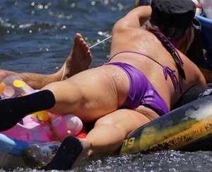 Sexy party girls in bikinis on a lake