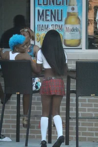 Sexy ebony Tilted Kilt employee in her uniform
