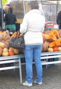 Mature milf in blue jeans at the market