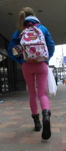 Skinny Girl With a Backpack in Pink Tight Pants Low Angle Photos