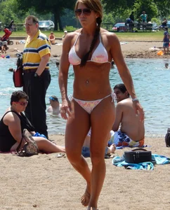 Lady with nice tits in a white bikini on the beach