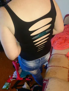 Girlfriend in tight blue jeans at home