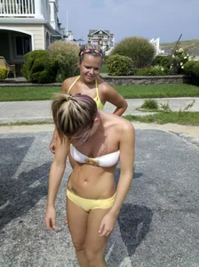 Two sexy babes in yellow bikinis at an ice cream truck