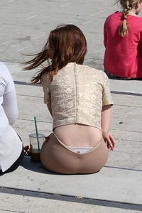Redhead looking beautiful and sexy in tight pants with a nice ass and showing her panties