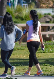Thick lady walking in leggings with a big booty