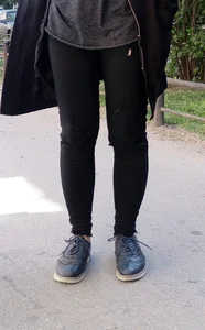 Tomboy's Legs in Tight Black Jeans Street Closeup