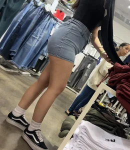 Cute salesgirl with tight Jean skirt showing some legs (OC)