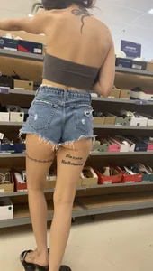 Slim Latina ass peeking out of shorts