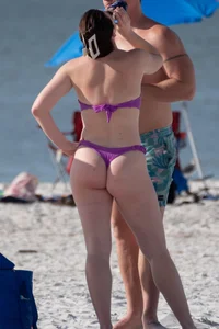 Pale chick in tiny purple thong