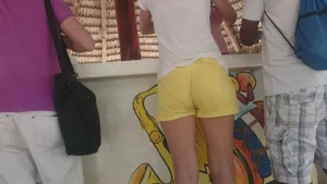 Milf in yellow shorts with vpl and a wedgie