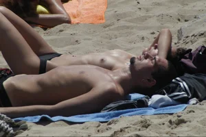 Girls on a nude beach in Sitges, Spain