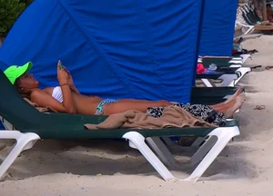 Pics of a video from a cute sunbathing bikini teen
