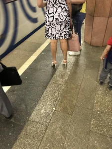 Hot milf's crossed legs in a subway train and at the station creepshots