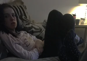 Skinny Girl in Tights Lying on a Couch With Crossed Legs Home Photo