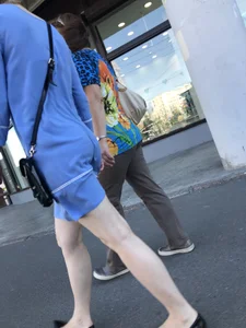 Girl in a Blue Dress With Pale Legs Walking Down the Street - Strong Wind Making Her Panty Line Visible