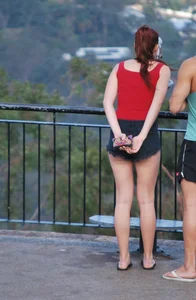 Redhead beauty in short shorts showing some cheeks and panties