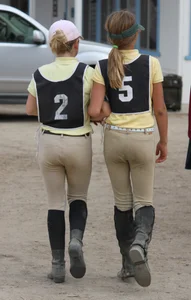 two teen horse riders in beige jodhpurs