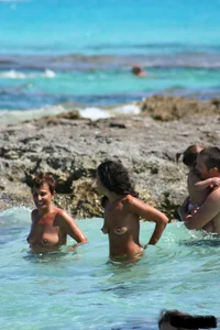 Nude beach ladies in the water showing their tits