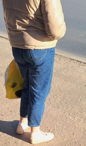 Nice ass in blue jeans on the street, blonde candid milf waiting for a bus