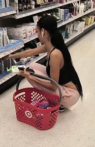 Latina bends over showing thong and chain lace!