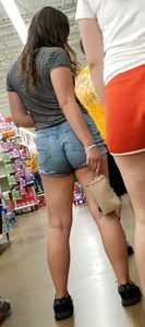 Brunette in jean shorts shopping @ walmart with friends