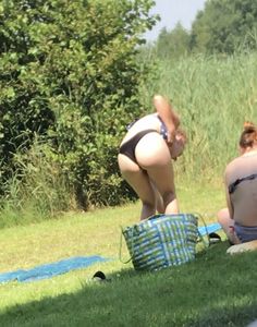 Sexy teen on the beach changing