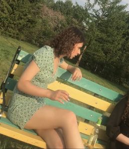 Candid girl with hot legs wearing a short dress sitting on the park bench creepshot