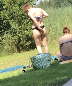 Sexy teen on the beach changing